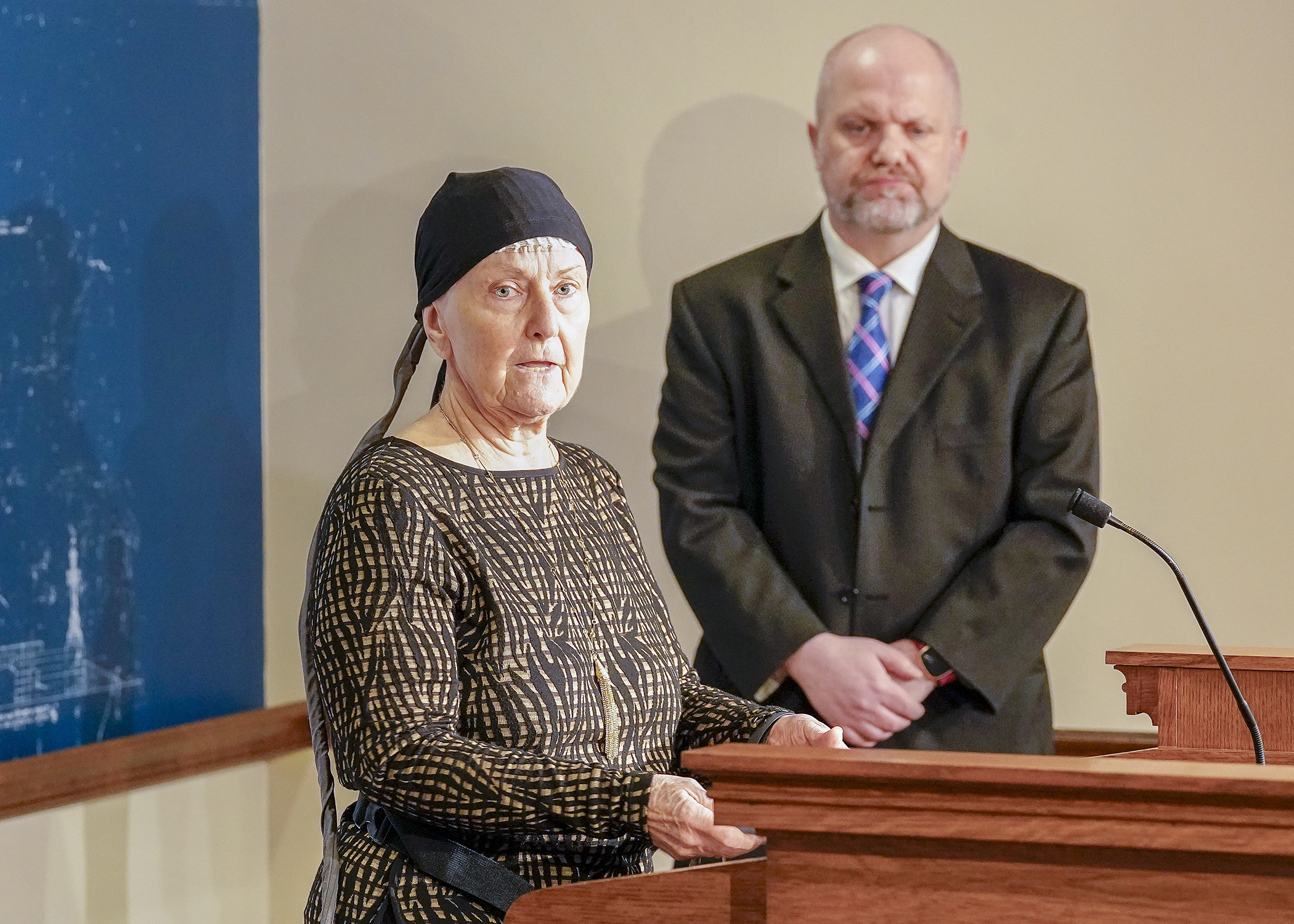 Nancy Uden, who has glioblastoma multiforme, a very aggressive form of malignant brain cancer, speaks at a Jan. 25 press conference in support of HF1930, the End-of-Life Option Act. Rep. Mike Freiberg, behind, is the bill sponsor. (Photo by Andrew VonBank)